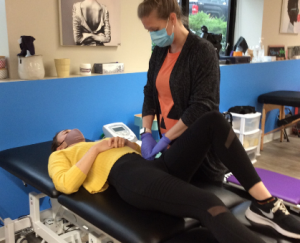 Christina Verhorevoort, PT, DPT performing manual therapy.