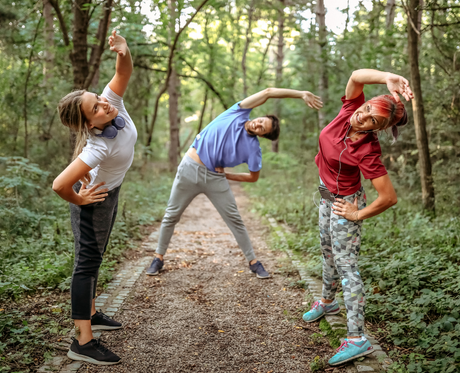 Three runners warming up to prevent overuse injuries.